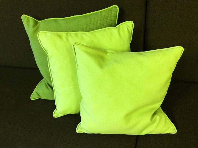green pillows on brown sofa